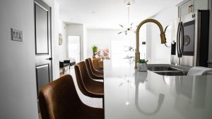Luxury kitchen island with wide circulation aisles and stone countertop
